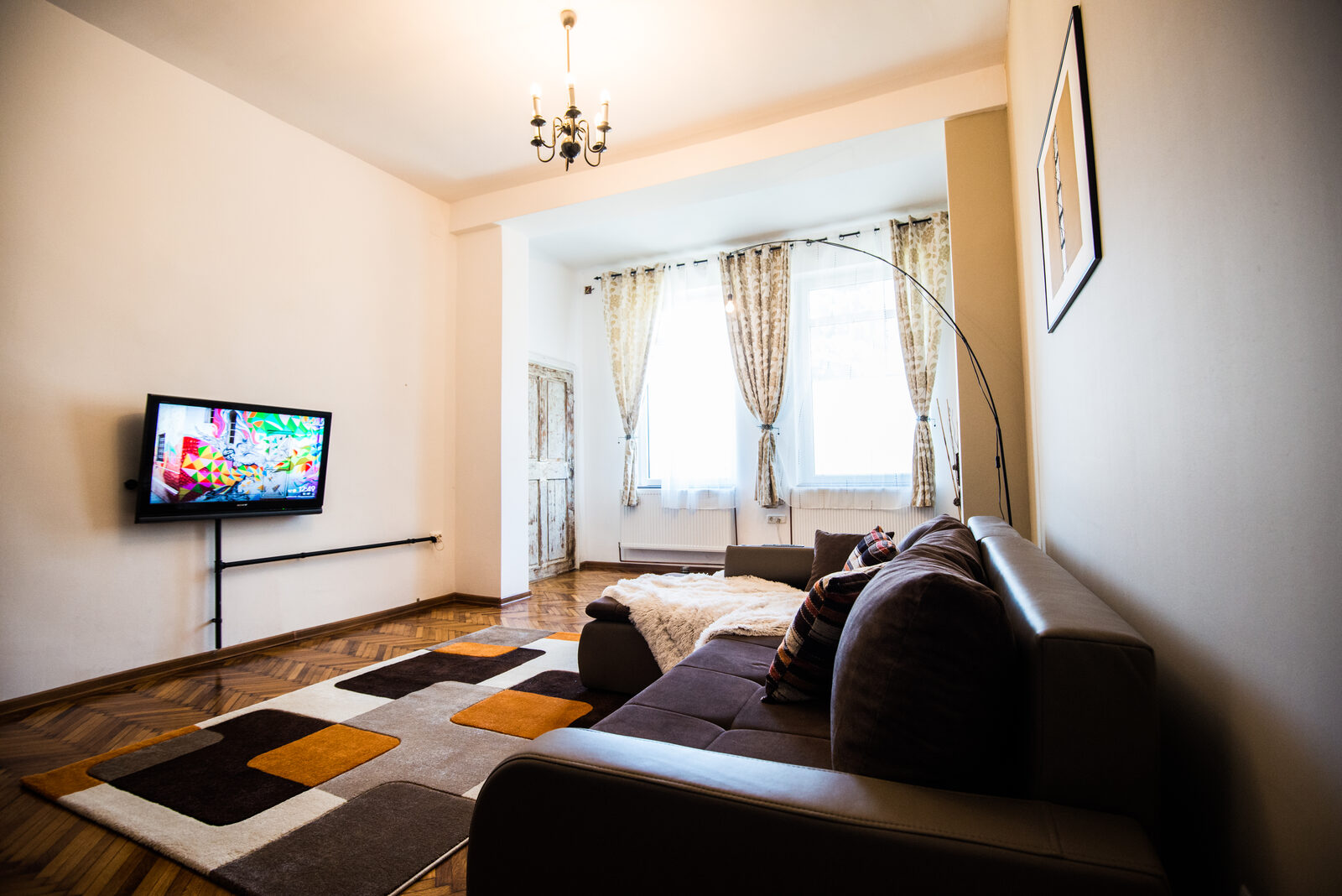 Living room with chandelier and large window